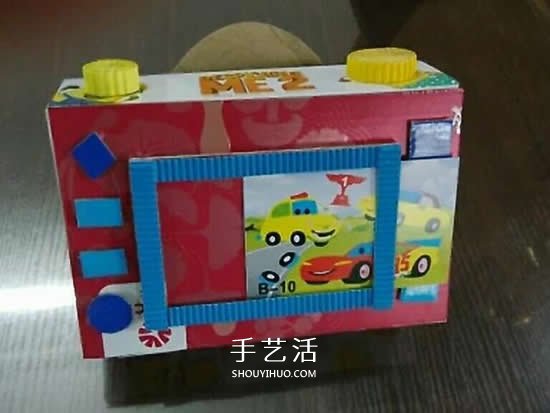 幼儿园手工作品图片 废物利用做的漂亮相机(图5) 幼儿园手工作品图片 废物利用做的漂亮相机(图5)